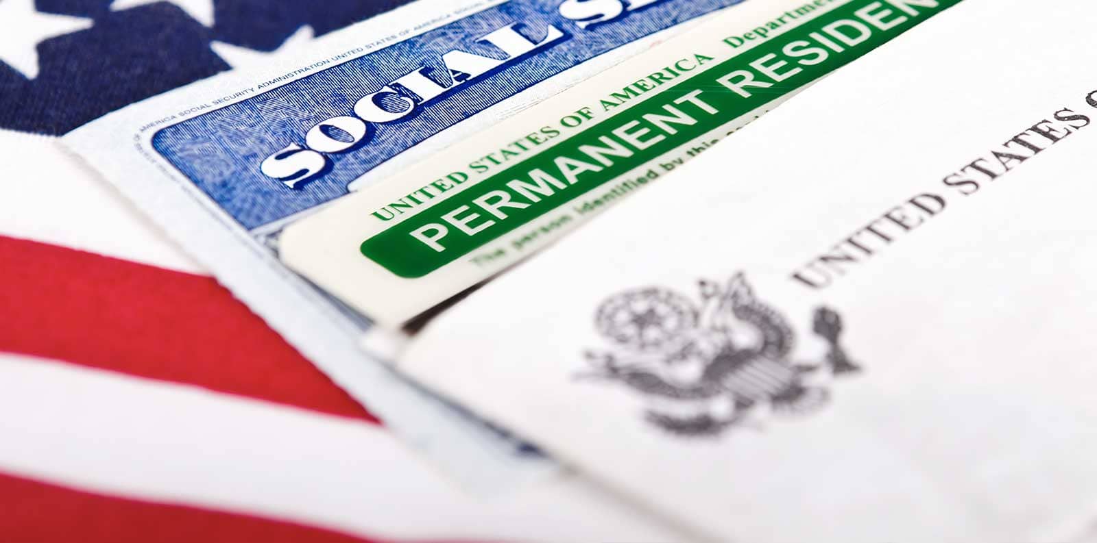 close-up of a green card amongst other personal documents